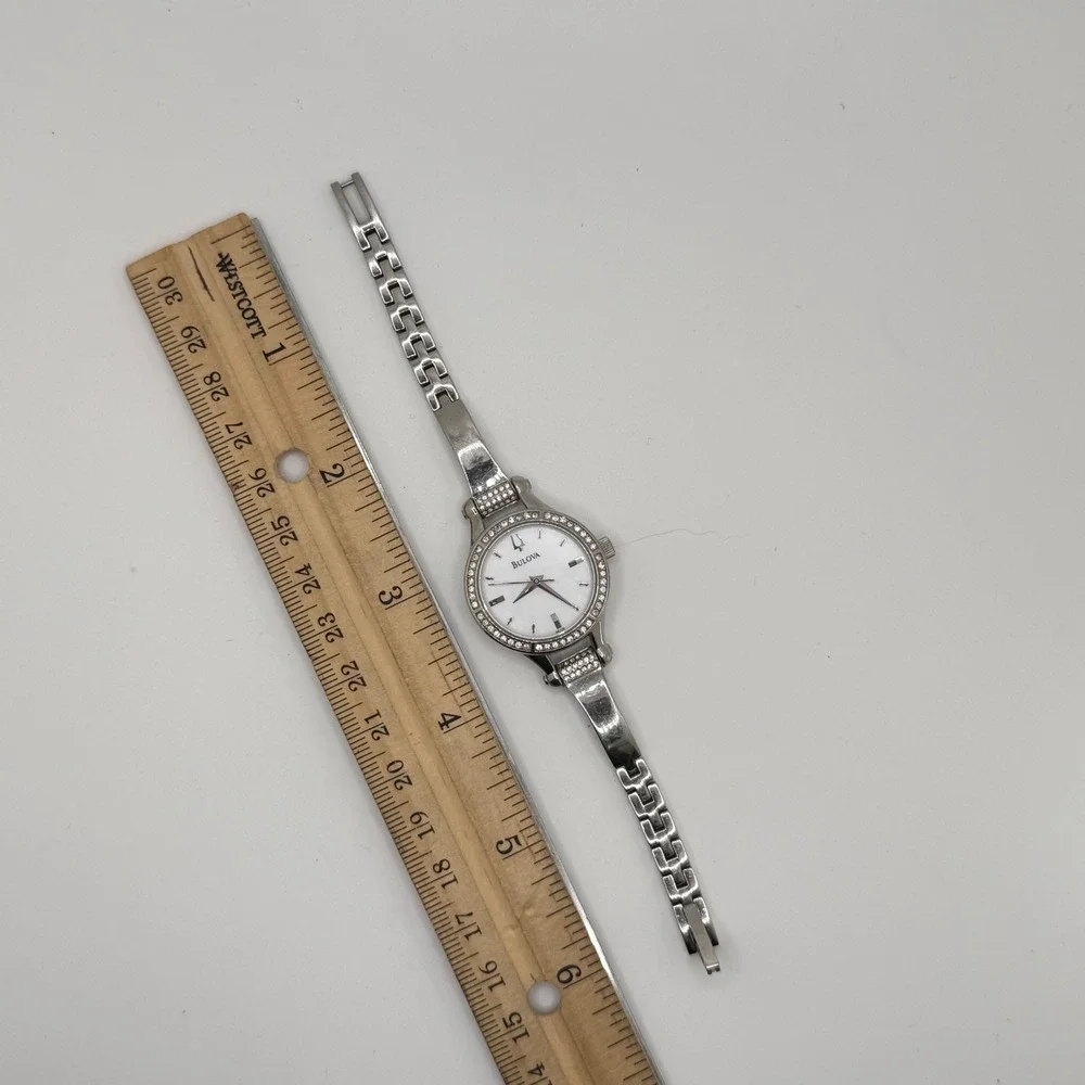 Bulova‎ Women Silver Tone Crystal Bezel White Dial Bangle Watch C869915 READ